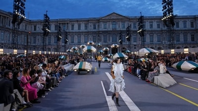 Nicolas Ghesquiere sent models down the runway dressed in light fabrics, sheer dresses, and fluid tailoring. Reportedly, he said the Spring/Summer 2027 collection was built around rising temperatures, which have changed the way he thinks about clothes. (AP Photo/Aurelien Morissard) Nicolas Ghesquiere sent models down the runway dressed in light fabrics, sheer dresses, and fluid tailoring. Reportedly, he said the Spring/Summer 2027 collection was built around rising temperatures, which have changed the way he thinks about clothes. (AP Photo/Aurelien Morissard)