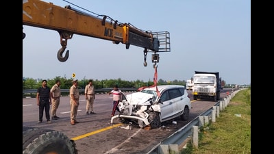 Police officials at the accident site on the Purvanchal Expressway, in Sultanpur. (PTI Photo)