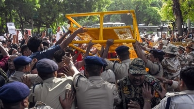 Protestors breach security barricades during a protest against Chief Election Commissioner Gyanesh Kumar near Jantar Mantar, in New Delhi on Saturday. (ANI) Protestors breach security barricades during a protest against Chief Election Commissioner Gyanesh Kumar near Jantar Mantar, in New Delhi on Saturday. (ANI)
