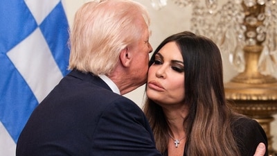 Donald Trump, left, and Kimberly Guilfoyle, US ambassador to Greece, during a Greek Independence Day celebration in the East Room of the White House in Washington, DC, US, on Thursday, March 26. (Bloomberg) Donald Trump, left, and Kimberly Guilfoyle, US ambassador to Greece, during a Greek Independence Day celebration in the East Room of the White House in Washington, DC, US, on Thursday, March 26. (Bloomberg)