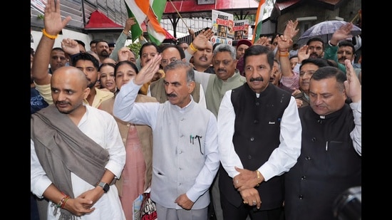 Chief Minister Sukhvinder Singh Sukhu with deputy chief minister Mukesh Agnihotri and Congress workers and leaders during a protest in Shimla on Wednesday. (Deepak Sansta/HT)