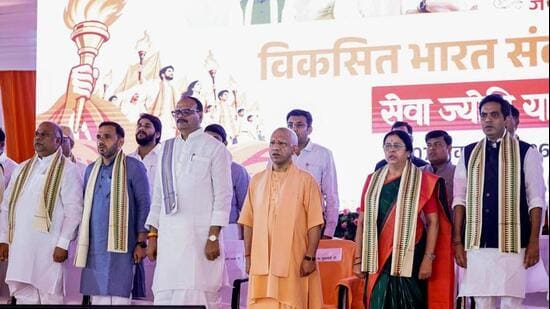 Chief minister Yogi Adityanath, deputy chief minister Brajesh Pathak and others during the ‘Seva Jyoti Yatra - Viksit Bharat Sankalp Sabha’ event in Lucknow on Wednesday. (ANI PHOTO)