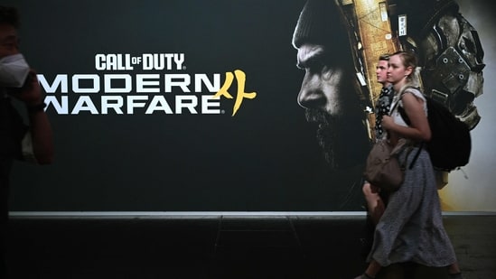 Gamers walk past an advertisement for the Call of Duty 4: Modern Warfare video game of Infinity Ward at the Gamescom video games trade fair on the fair grounds in Cologne, western Germany, on August 26. (Representational)