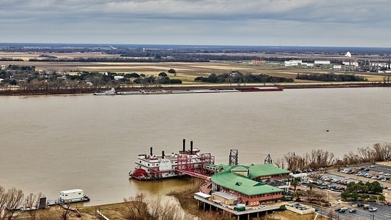 The Mid-Barataria Sediment Diversion project aimed to restore Louisiana's coastline by reconnecting the Mississippi River to the Barataria Basin. Despite initial progress, including permits and funding, it was terminated in July 2025 due to cost and legal concerns. The state is now focusing on alternative restoration efforts.