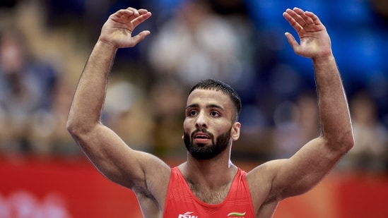 India's Sujeet Kalkal celebrates after winning gold medal in the men's Freestyle 65 kilogram final bout 196 wrestling event in the ongoing Asian Games 2026, in Nagoya, Japan, Friday, Oct. 2, 2026.