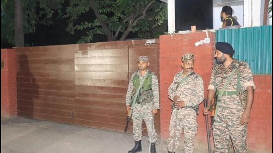 Paramilitary force personnel standing guard as the CBI team conducted searches at the house of the chief minister’s officer on special duty (OSD) Rajbir Ghuman in Sector 2, Chandigarh, on Tuesday night. (Keshav Singh/HT)