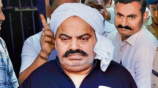 Prayagraj Police with jailed-mafia Atiq Ahmed outside Sabarmati Central Jail as he is being shifted to Prayagraj. (PTI) (Representative Image)