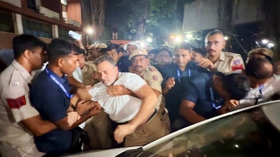 Lok Sabha LoP Rahul Gandhi being detained by Delhi Police during a sit-in protest staged by INDIA bloc MPs at Akashvani Bhavan against Chief Election Commissioner Gyanesh Kumar, in New Delhi on Tuesday. (AICC)