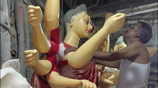 The traditional idols strictly adhere to the scriptural rules regarding the Goddess’ posture, facial expressions, colour, weapons and ten ar