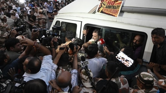 Delhi Police personnel detain LOP Rahul Gandhi at Windsor roundabout in New Delhi during the protest. (HT Photo/Sanjeev Verma)