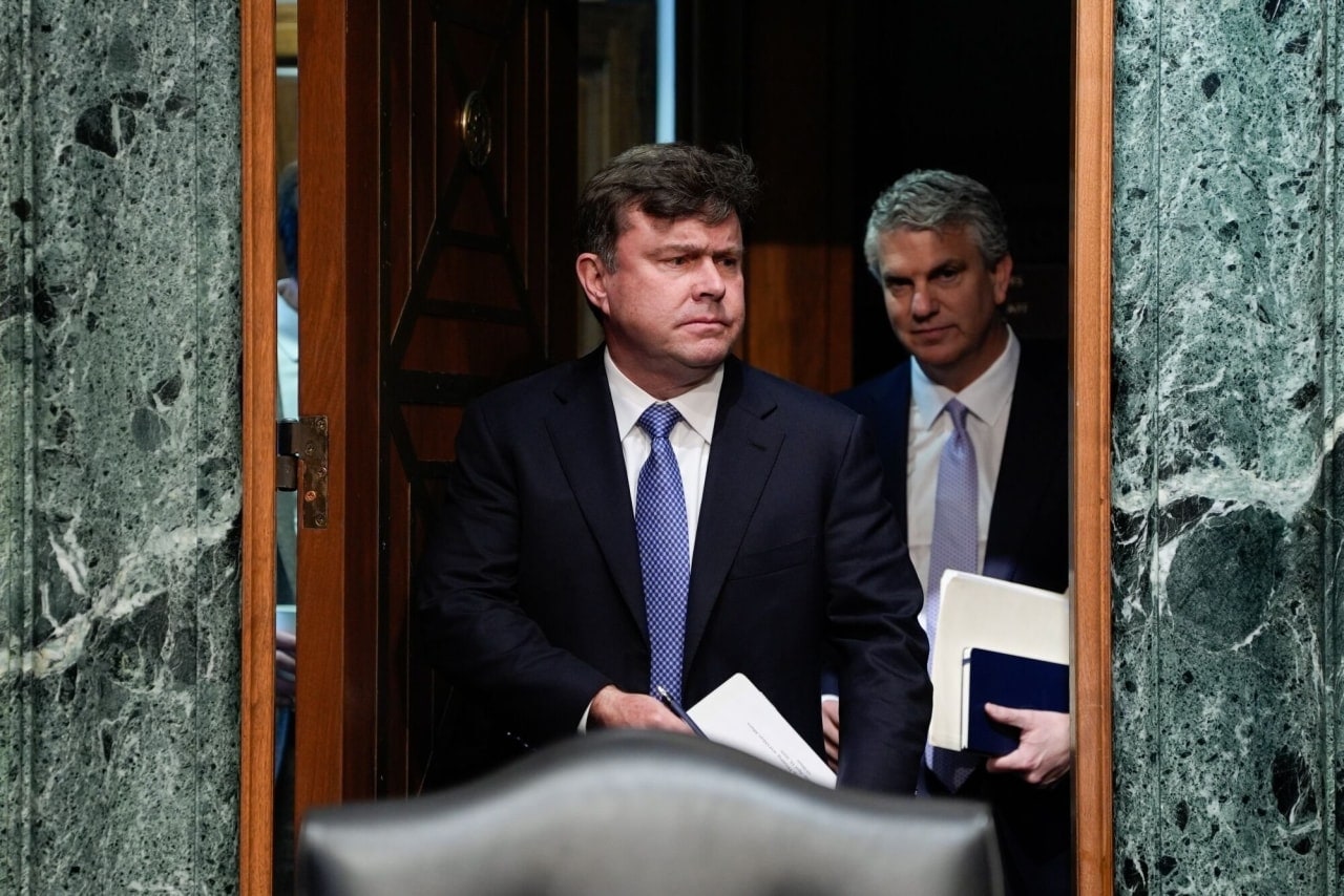 John Hurley, center, arrived for his Senate confirmation hearing in April 2025. John Hurley, center, arrived for his Senate confirmation hearing in April 2025.