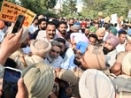 AAP leaders and activists protesting outside BJP office in Ludhiana on Wednesday. (Gurpreet Singh/HT)