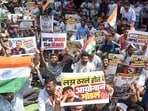 Students hold placards and shout slogans as they stage a protest against the Maharashtra Public Service Commission (MPSC) exam paper leak.