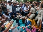 Lok Sabha LoP Rahul Gandhi stops Delhi Police from detaining Congress MP Priyanka Gandhi Vadra and others during the INDIA bloc MPs' protest against Chief Election Commissioner Gyanesh Kumar near Jantar Mantar, in New Delhi. (AICC/ANI Photo)