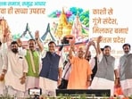BJP national president Nitin Nabin, Uttar Pradesh CM Yogi Adityanath, deputy CM Keshav Prasad Maurya, Assam CM Himanta Biswa Sarma, and others wave to the crowd at the concluding ceremony of the Seva Sankalp Yatra, in Varanasi on Wednesday. (ANI PHOTO)