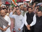 Chief Minister Sukhvinder Singh Sukhu with deputy chief minister Mukesh Agnihotri and Congress workers and leaders during a protest in Shimla on Wednesday. (Deepak Sansta/HT)