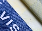 This illustration picture shows a US visa in a passport in Mexico City on August 25, 2026. The US government plans to revoke the visas of foreigners who came to the country for tourism or business but sought to stay longer by applying for asylum, the State Department said on August 25, 2026. (Photo by Yuri CORTEZ / AFP)