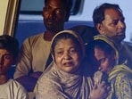 Mourning family members at the site the collapse. (HT PHOTO)