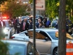 Members of law enforcement gather at the scene after a shooting reportedly involving US Immigration and Customs Enforcement (ICE) officers in the Bronx borough of New York City, on Thursday,