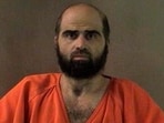 Nidal Hasan, charged with killing 13 people and wounding 31 in a November 2009 shooting spree at Fort Hood, is pictured in an undated handout photo obtained by Reuters on June 29.