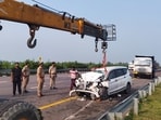 Police officials at the accident site on the Purvanchal Expressway, in Sultanpur. (PTI Photo)