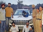 The accused in police custody in Ludhiana on Thursday. The police recovered the stolen cash and vehicle from them. (HT Photo)