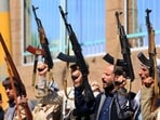Fighters loyal to the Houthi authorities, take part in a rally to recruit more fighters, in Sanaa on October 7, 2026. The Houthis claimed a flurry of attacks on Saudi targets on October 7 including firing a ballistic missile at Riyadh airport, as the group battles for territory in Yemen against government forces supported by the kingdom.