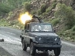 This screen grab is taken from video footage, which shows a fighter affiliated with the Houthi authorities firing a truck-mounted machine gun as they advance against Saudi-backed Yemeni government troops in Taiz Governorate. 
