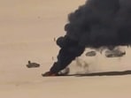 An aerial view of a burning vehicle during drone attacks on Yemeni government forces at an undefined location in Yemen. 
