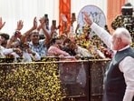 Prime Minister Narendra Modi waves to supporters during the Viksit Bharat Sankalp Sabha at the Indira Gandhi Indoor Stadium, in New Delhi. (PTI)