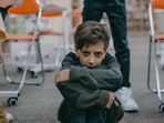 Pulling away from people near them is one of the signs that a child is experiencing bullying, Dr Jindal shares. 