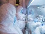 This undated photo released in 2019 by the Irkutsk Anti-Plague Research Institute of Siberia and Far East, shows the institute workers in a lab.