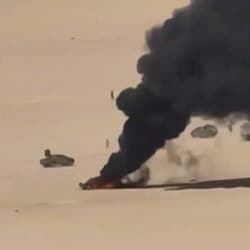 An aerial view of a burning vehicle during drone attacks on Yemeni government forces at an undefined location in Yemen. 