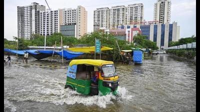Commuters make way through a waterlogged road as the swollen Gomti inundates Shaheed Path area, in Lucknow on Thursday. (ANI Photo) Commuters make way through a waterlogged road as the swollen Gomti inundates Shaheed Path area, in Lucknow on Thursday. (ANI Photo)