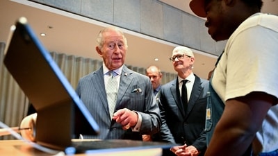 King Charles in conversation with a man who said he was laid off from Microsoft. (via REUTERS)
