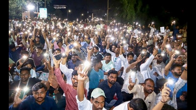 MPSC aspirants display phone flashlights during a protest over various issues, in Pune, Saturday, Oct. 3. (PTI) MPSC aspirants display phone flashlights during a protest over various issues, in Pune, Saturday, Oct. 3. (PTI)