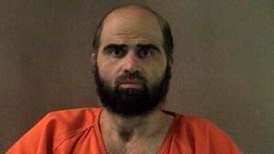 Nidal Hasan, charged with killing 13 people and wounding 31 in a November 2009 shooting spree at Fort Hood, is pictured in an undated handout photo obtained by Reuters on June 29.