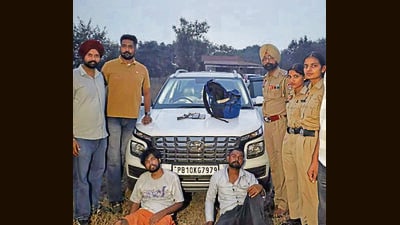 The accused in police custody in Ludhiana on Thursday. The police recovered the stolen cash and vehicle from them. (HT Photo) The accused in police custody in Ludhiana on Thursday. The police recovered the stolen cash and vehicle from them. (HT Photo)