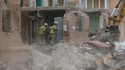 Rescuers continue to remove debris at the site of an apartment building hit by a Russian missile strike, in which at least 22 residents have been killed according to State Emergency Service, in the town of Pryluky, amid Russia's attack on Ukraine, in the Chernihiv region, Ukraine. (REUTERS)