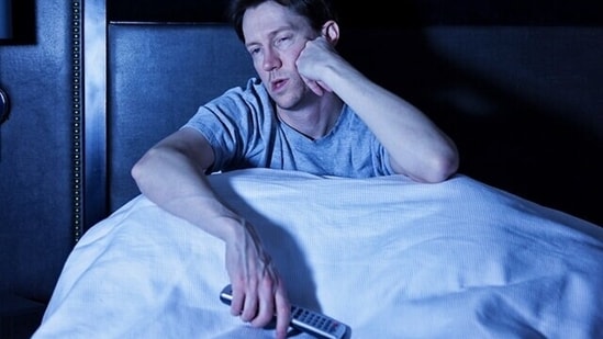 Is sleeping with the TV on bad for your heart? (Adobe Stock)
