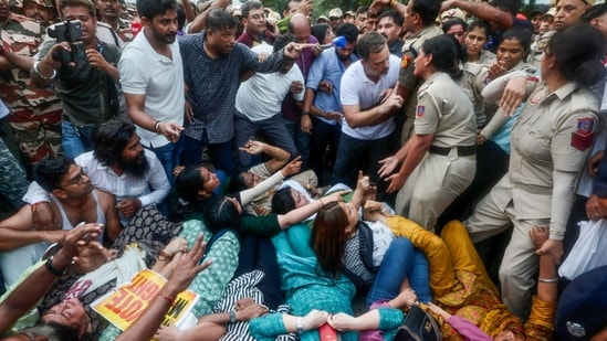 Lok Sabha LoP Rahul Gandhi stops Delhi Police from detaining Congress MP Priyanka Gandhi Vadra and others during the INDIA bloc MPs' protest against Chief Election Commissioner Gyanesh Kumar near Jantar Mantar, in New Delhi. (AICC/ANI Photo)