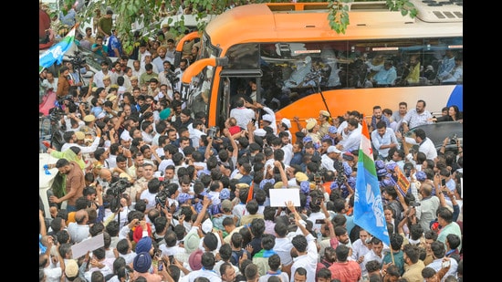 Congress and INDIA bloc supporters as INDIA bloc MPs, including Leader of the Opposition in the Lok Sabha Rahul Gandhi and Leader of the Opposition in the Rajya Sabha Mallikarjun Kharge, board a bus in Connaught Place before heading towards Rajghat to stage a protest in New Delhi on Thursday. (RAJ K RAJ /HT PHOTO)