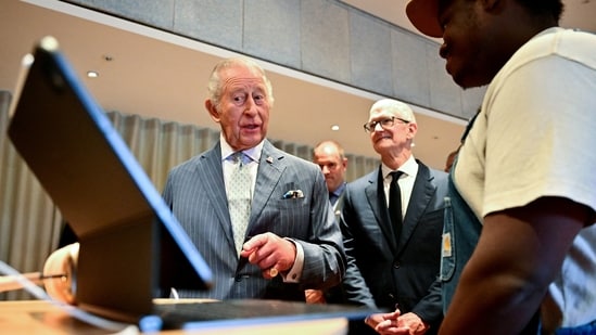 King Charles in conversation with a man who said he was laid off from Microsoft. 