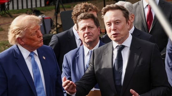 SpaceX AI Founder and CEO Elon Musk speaks to the media and US President Donald Trump listens at the White House driveway following a luncheon for tech leaders in the East Room, in Washington, D.C., US, September 29, 2026.