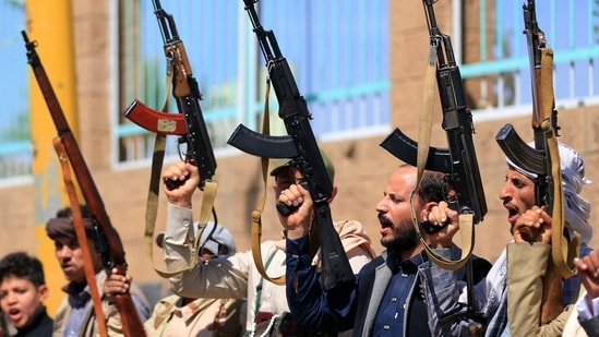 Fighters loyal to the Houthi authorities, take part in a rally to recruit more fighters, in Sanaa on October 7, 2026. The Houthis claimed a flurry of attacks on Saudi targets on October 7 including firing a ballistic missile at Riyadh airport, as the group battles for territory in Yemen against government forces supported by the kingdom. (Photo by Mohammed HUWAIS / AFP)