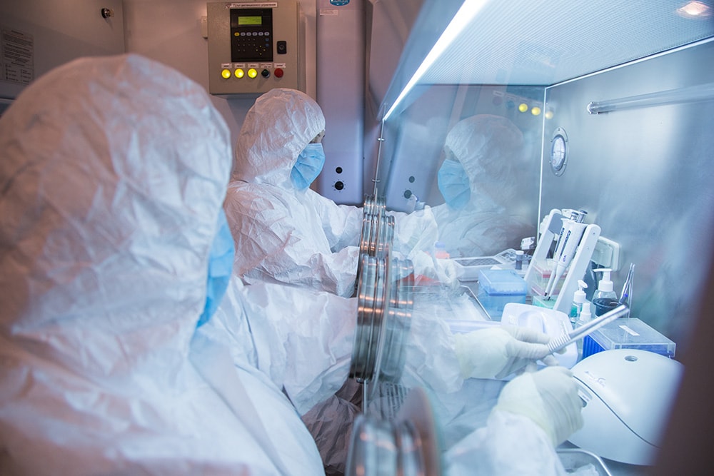 This undated photo released in 2019 by the Irkutsk Anti-Plague Research Institute of Siberia and Far East, shows the institute workers in a lab. (AP/The Irkutsk Anti-Plague Research)