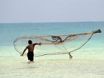 A fisherman casts his net at South Bay in Little Andaman Island. (Adhith Swaminathan)