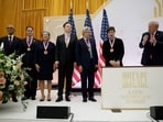 CEO of Microsoft Satya Nadella, Dell Technologies CEO Michael Dell, AMD CEO Lisa Su, Tesla and SpaceX CEO Elon Musk, NVIDIA CEO Jensen Huang, and Google co-founder Sergey Brin stand with US President Donald Trump. 