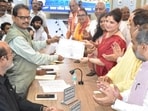 BJP candidate Priyanka Singh Rawat collects her certificate from the returning officer after she was elected unopposed to the Rajya Sabha on Friday. (SOURCED IMAGE)