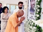 Chief minister Yogi Adityanath pays tribute to Ram Vilas Paswan, while LJP (RV) chief Chirag Paswan looks on, during a programme in Lucknow on Thursday. (ANI)